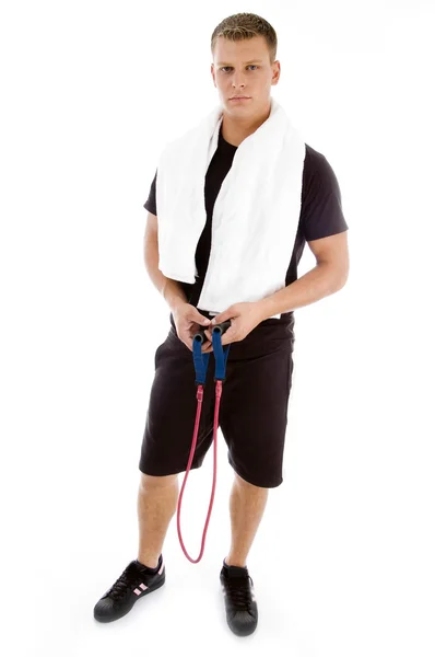 Fitness man posing with stretching rope — Stock Photo, Image