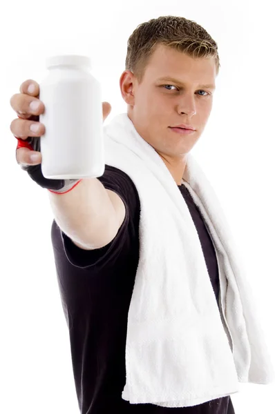 筋肉の男性示す薬瓶や容器 — ストック写真