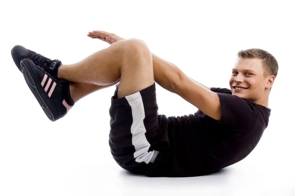 Muscular guy doing crunches — Stock Photo, Image