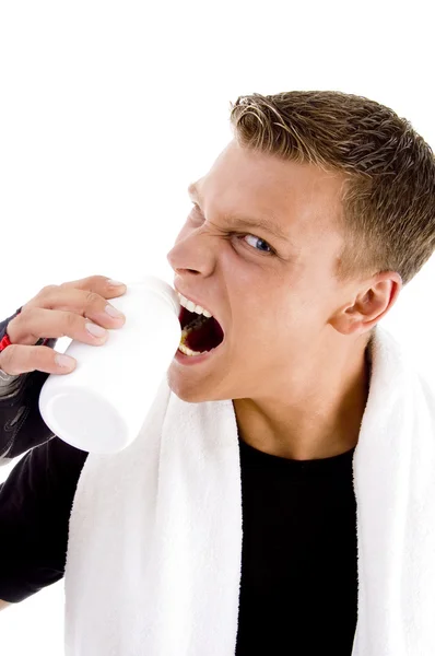Άνθρωπος που κρατά το καπάκι του φιαλιδίου με το στόμα — Φωτογραφία Αρχείου