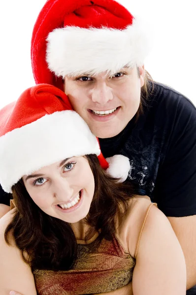 戴圣诞帽的年轻夫妇 — 图库照片