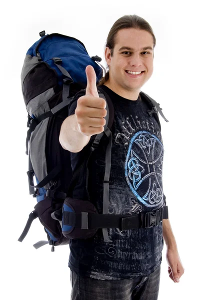 Traveler with rucksack and thumbs up — Stock Photo, Image