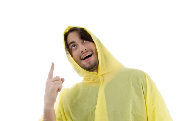 Man wearing raincoat pointing upwards — Stock Photo, Image