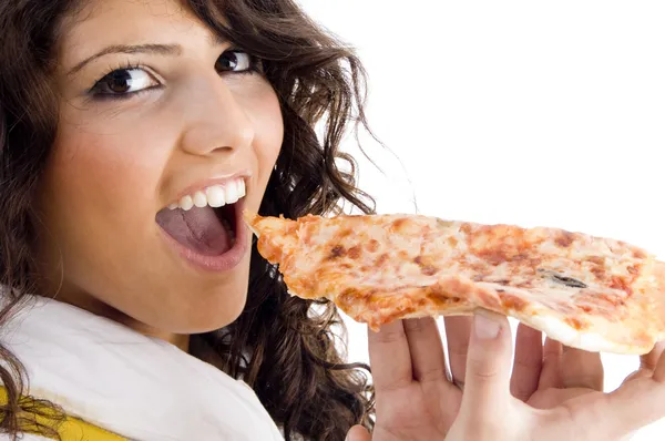 Hübsche Frau isst leckere Pizza Stockfoto