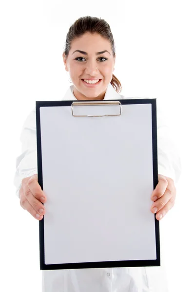 Smiling doctor showing writing pad Stock Photo
