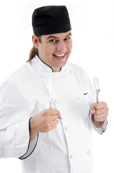 Portrait of chef with knife and fork Stock Picture