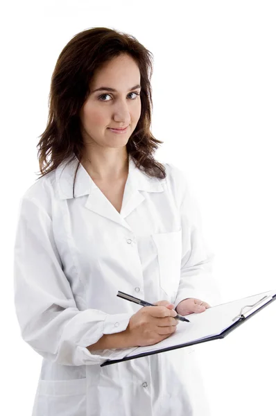 Médecin féminin avec bloc-notes de prescription Images De Stock Libres De Droits