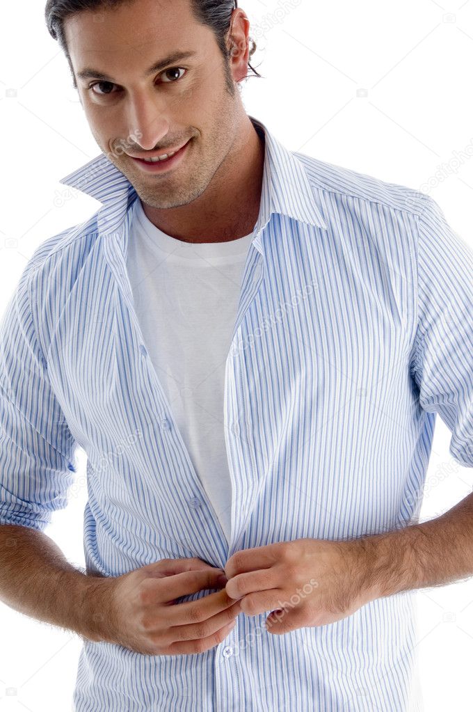 Man tucking his shirt buttons