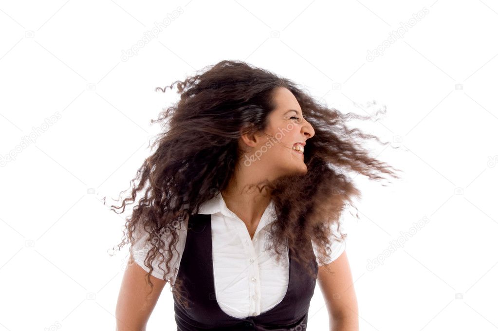 Portrait of dancing woman flicking hair