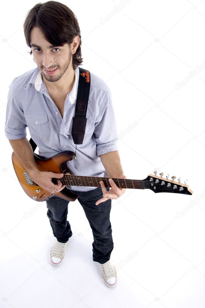 Young rock star playing guitar