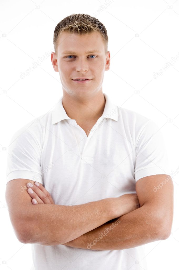 Handsome youth with folded arms, posing