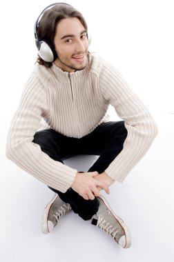 Handsome male listening to music clipart