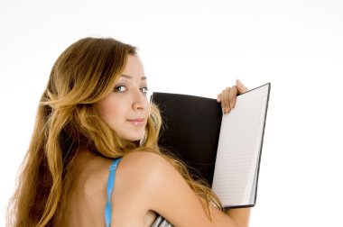 Girl with open notebook looking backward clipart