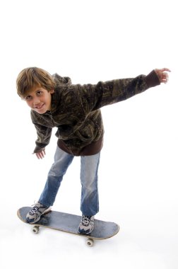 Front view of boy riding skateboard clipart