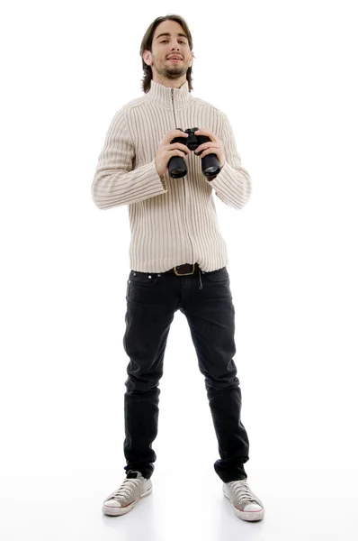 Handsome man holding binoculars — Stock Photo, Image