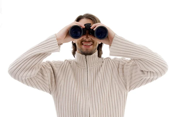 Hombre mirando a través de prismáticos — Foto de Stock