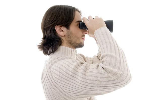 Mann beobachtet durch Fernglas — Stockfoto