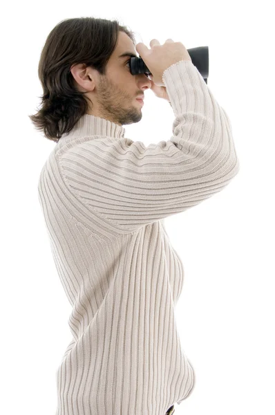 Man watching through binoculars — Stock Photo, Image