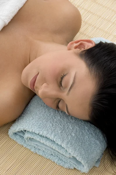 Resting young female in spa — Stock Photo, Image