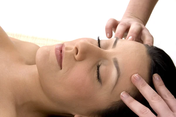 Young woman taking head massage — Stock Photo, Image