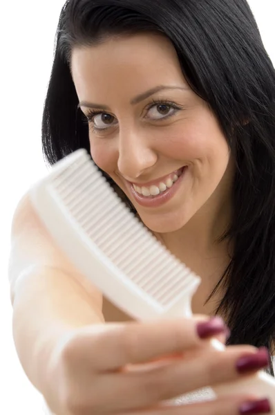 Portrait of female showing comb — Stock Photo, Image