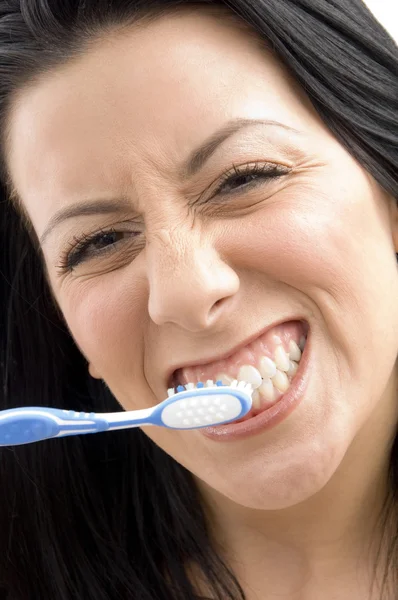 Close up of woman brushing her teeth — Stock Photo, Image