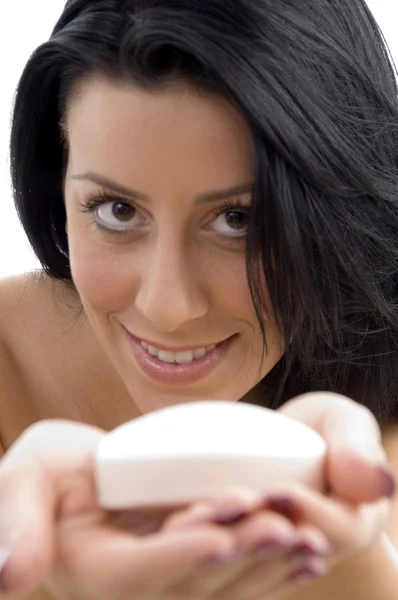 Close up of young female showing soap — Stock Photo, Image