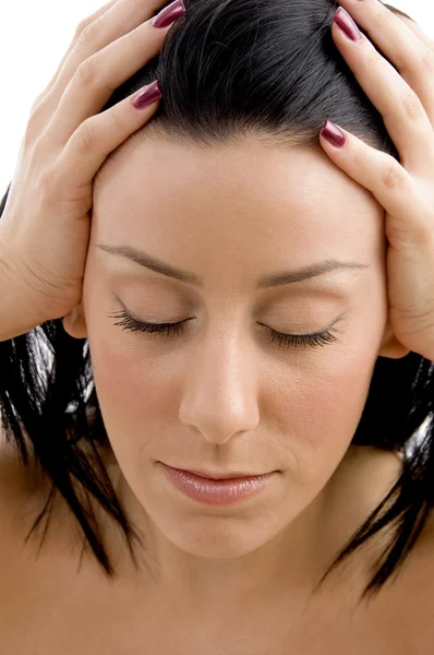 Close up of female holding her head — Stock Photo, Image