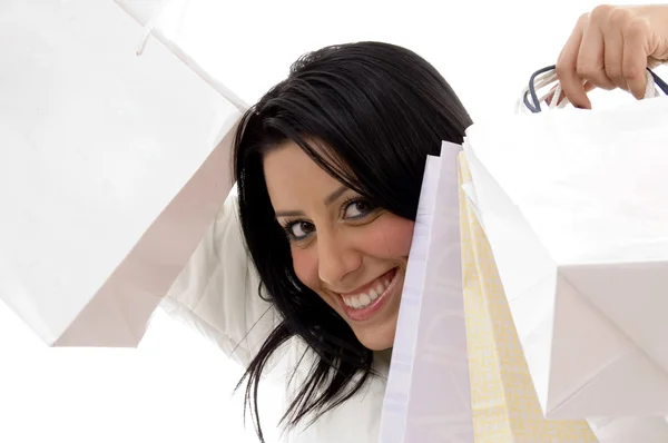 Cheerful female model with carry bags — Stock Photo, Image