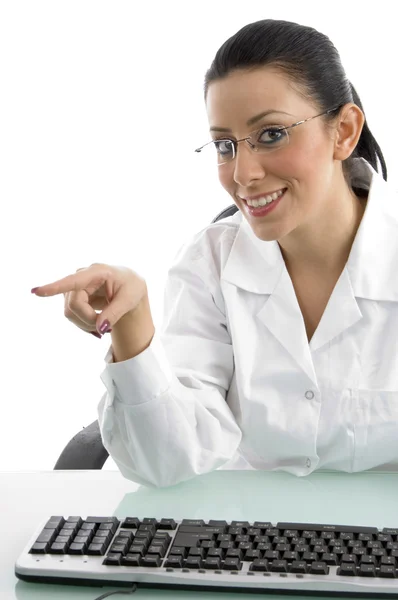 Pointing young doctor with keyboard — Stock Photo, Image
