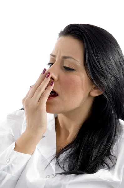 Tired female doctor yawning — Stock Photo, Image