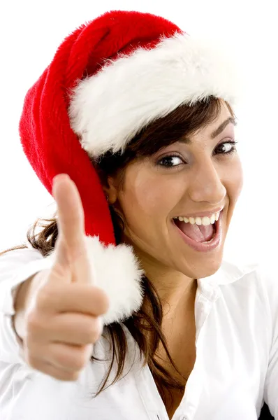 Feminino em chapéu de Natal com polegares para cima — Fotografia de Stock