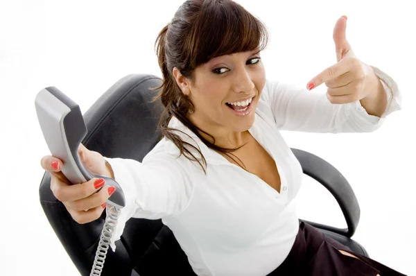 Businesswoman pointing at phone — Stock Photo, Image