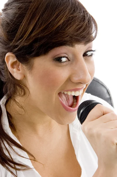 Female singing into microphone — Stock Photo, Image