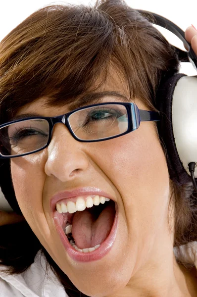 Close up of young woman tuned to music — Stock Photo, Image