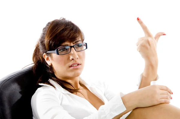 Frowning woman with pointing finger — Stock Photo, Image