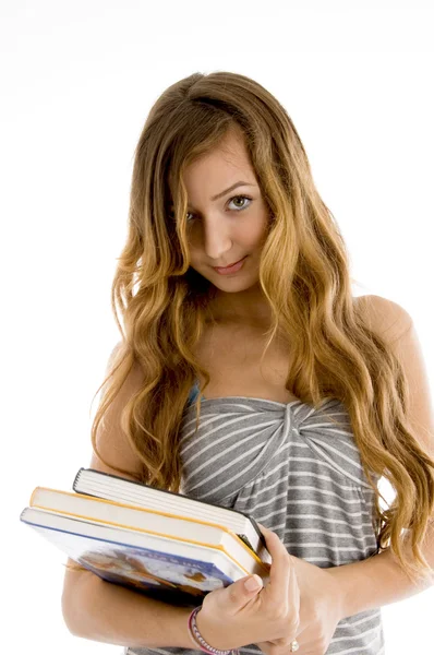 Bonito adolescente segurando livros — Fotografia de Stock