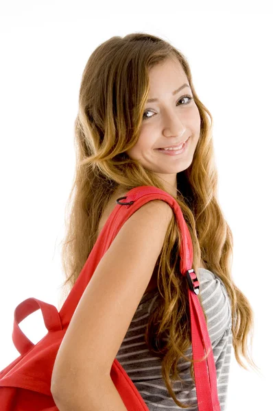 Улыбающийся милый студент с сумкой — стоковое фото