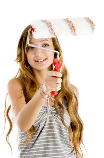 Cute painter showing roller brush — Stock Photo, Image