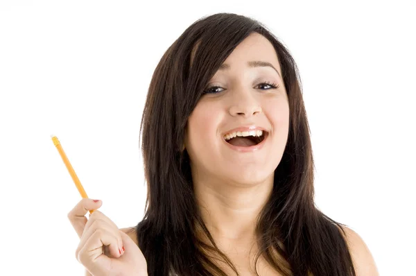 Sorridente giovane ragazza con matita — Foto Stock