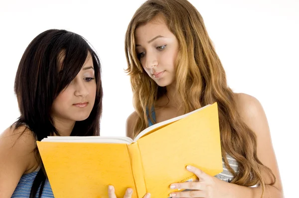 Young classmate looking in book — Stock Photo, Image