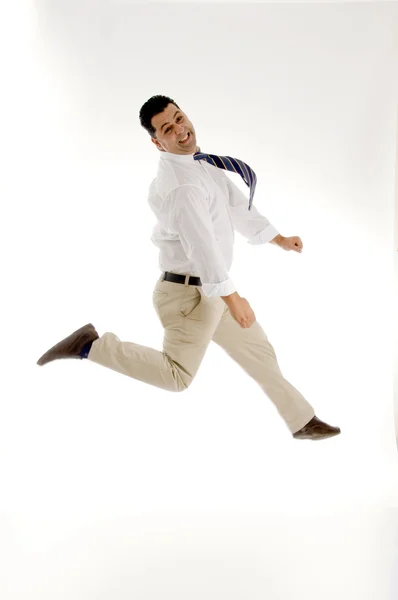 Businessman leaping in mid air — Stock Photo, Image