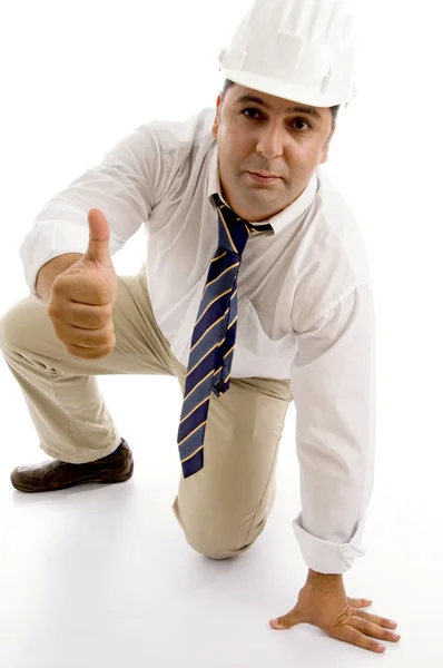 Architect with thumbs up, kneeling down — Stock Photo, Image