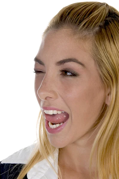 Female licking her lips with winked eyes — Stock Photo, Image