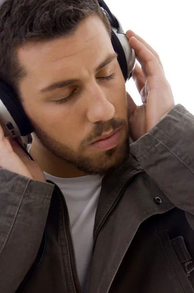Close up of man listening to music — Stock Photo, Image