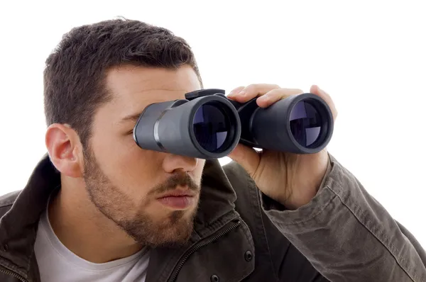 Muž se dívá dalekohledem — Stock fotografie