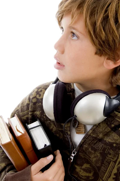 Niño de escuela con libros y auriculares —  Fotos de Stock