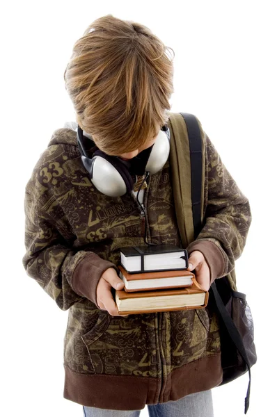 Chłopiec szkoły z książek i słuchawki — Zdjęcie stockowe