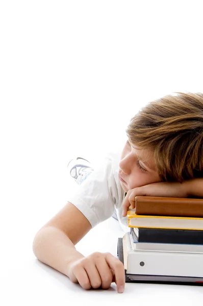 Pojken sover på böcker — Stockfoto