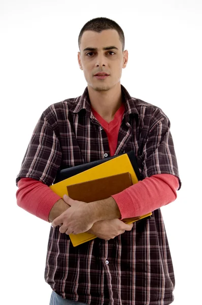 Estudiante sosteniendo libros y posando — Foto de Stock
